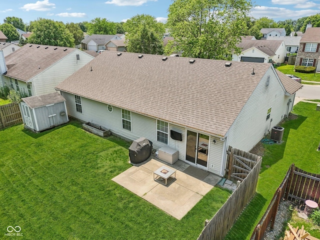 17357 Austrian Pine Way, Westfield, IN 46074 - back of house featuring a patio area, a residential view, roof with shingles, central AC, and an outdoor fire pit