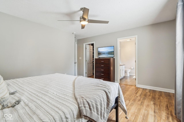 17357 Austrian Pine Way, Westfield, IN 46074 - bedroom featuring light wood-type flooring, baseboards, connected bathroom, and ceiling fan