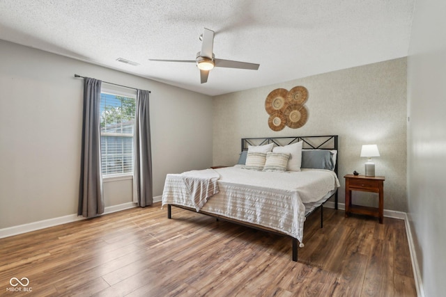 17357 Austrian Pine Way, Westfield, IN 46074 - bedroom featuring wood finished floors, baseboards, a textured ceiling, and ceiling fan