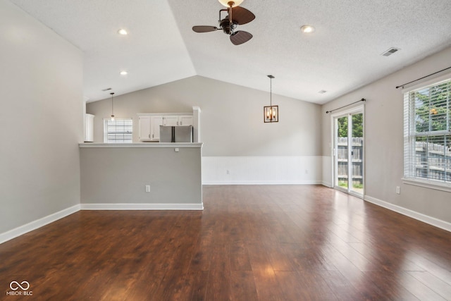 17357 Austrian Pine Way, Westfield, IN 46074 - unfurnished living room featuring ceiling fan, vaulted ceiling, dark wood-type flooring, baseboards, and recessed lighting