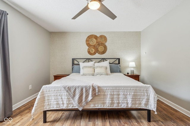 17357 Austrian Pine Way, Westfield, IN 46074 - bedroom with baseboards, an accent wall, ceiling fan, and wood finished floors