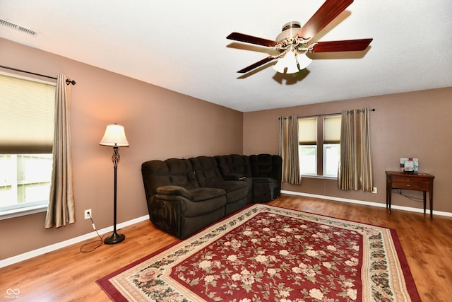 3429 Pavetto Ln, Indianapolis, IN 46203 - living area featuring wood finished floors and ceiling fan