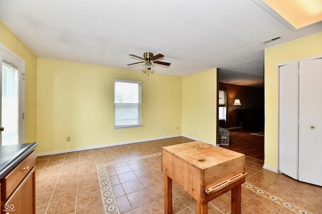 3429 Pavetto Ln, Indianapolis, IN 46203 - living area with light tile patterned floors and ceiling fan