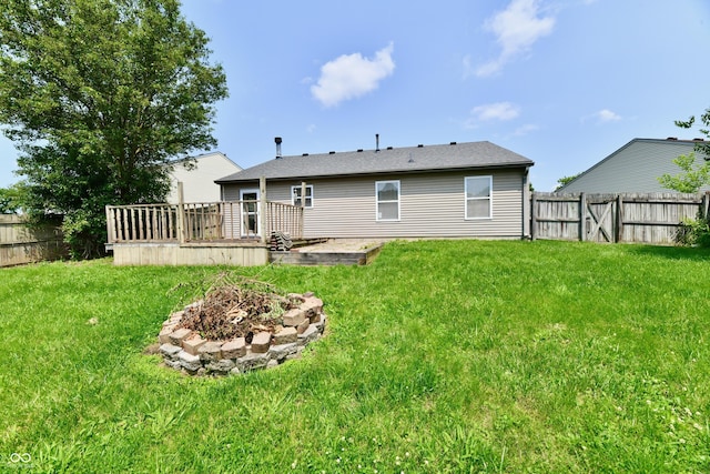 3429 Pavetto Ln, Indianapolis, IN 46203 - back of house with a fenced backyard, a deck, and an outdoor fire pit