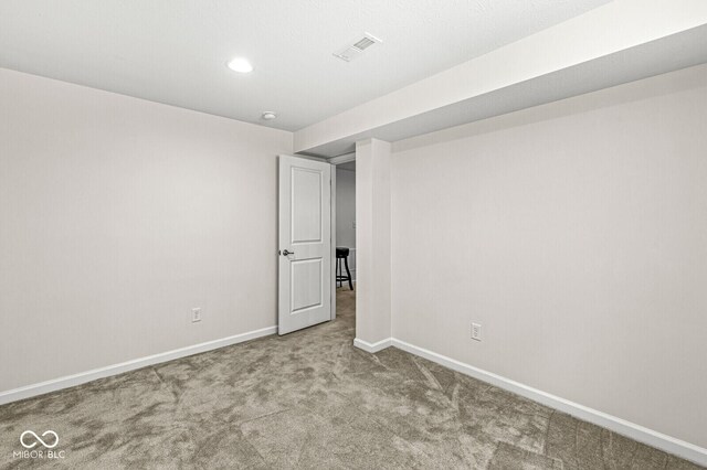 unfurnished room with carpet, baseboards, and recessed lighting