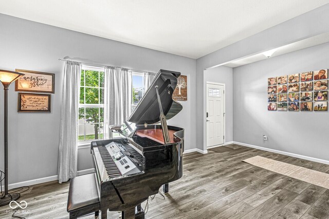 sitting room with wood finished floors and baseboards