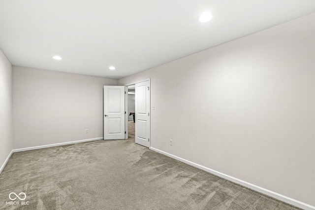 unfurnished bedroom featuring baseboards, carpet, and recessed lighting