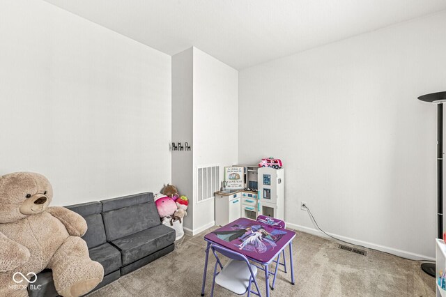 playroom with carpet flooring and baseboards