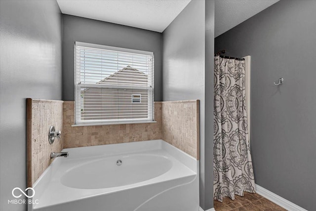 2434 Burgundy Way, Plainfield, IN 46168 - bathroom with a garden tub, baseboards, and a shower with shower curtain