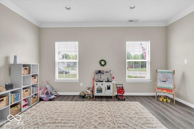 2434 Burgundy Way, Plainfield, IN 46168 - game room featuring ornamental molding, wood finished floors, plenty of natural light, baseboards, and recessed lighting