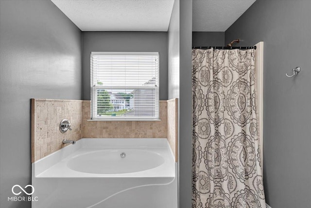 2434 Burgundy Way, Plainfield, IN 46168 - bathroom with a bath, curtained shower, and a textured ceiling