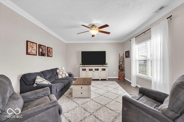 2434 Burgundy Way, Plainfield, IN 46168 - living area with a ceiling fan, crown molding, wood finished floors, and baseboards