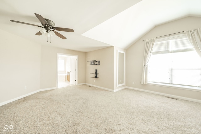 10555 Serra Vista Pt, Fishers, IN 46040 - unfurnished living room with a ceiling fan, carpet, baseboards, and vaulted ceiling