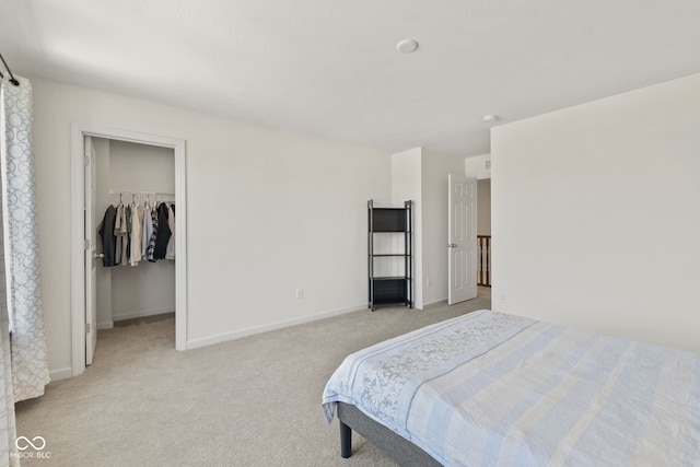 1026 Sorrell Pass, Greenwood, IN 46143 - bedroom featuring light colored carpet, a spacious closet, baseboards, and a closet
