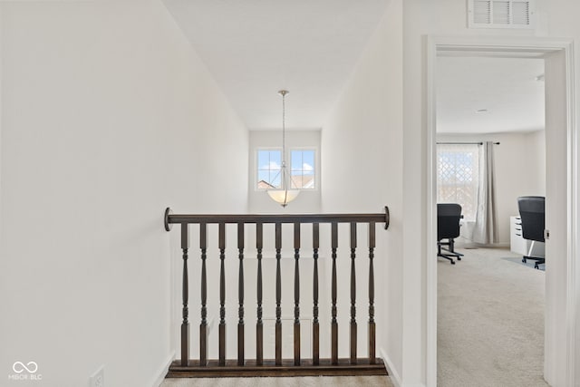 1026 Sorrell Pass, Greenwood, IN 46143 - staircase with plenty of natural light, carpet floors, a chandelier, and baseboards