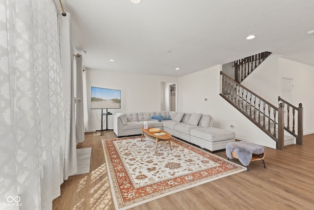 1026 Sorrell Pass, Greenwood, IN 46143 - living room featuring wood finished floors, stairway, recessed lighting, and baseboards