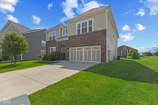 1026 Sorrell Pass, Greenwood, IN 46143 - view of front of property with brick siding, a garage, driveway, and a front yard