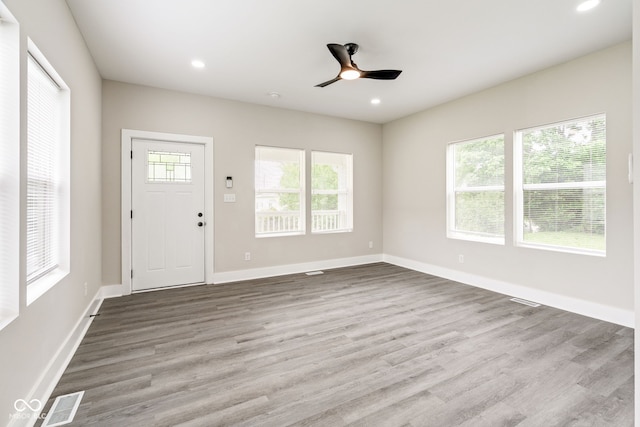 2427 N Rural St, Indianapolis, IN 46218 - entryway with wood finished floors, ceiling fan, recessed lighting, and baseboards