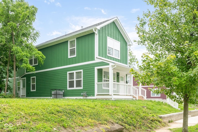 2427 N Rural St, Indianapolis, IN 46218 - view of property exterior with a porch and board and batten siding