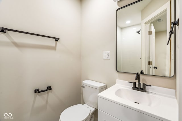 2427 N Rural St, Indianapolis, IN 46218 - bathroom with toilet and vanity