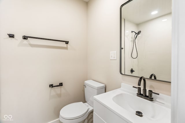 2427 N Rural St, Indianapolis, IN 46218 - bathroom featuring toilet, vanity, and a tile shower