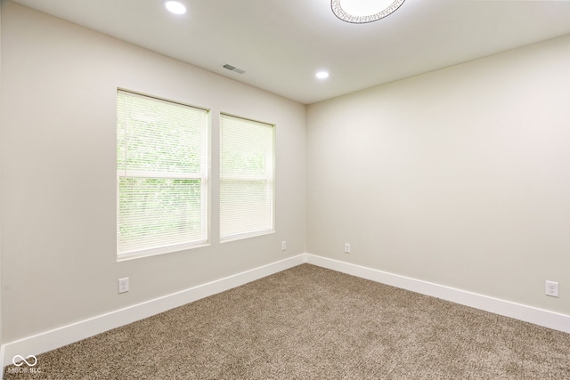 2427 N Rural St, Indianapolis, IN 46218 - carpeted spare room featuring baseboards and recessed lighting