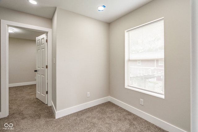 2427 N Rural St, Indianapolis, IN 46218 - carpeted spare room with baseboards