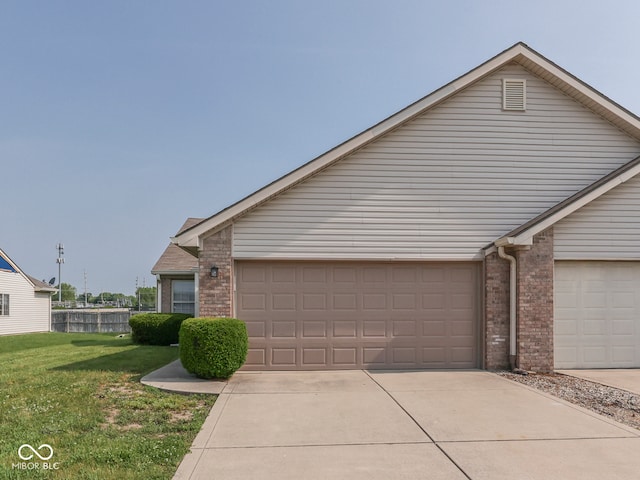 824 Ashton Park Dr, Greenwood, IN 46143 - traditional-style home featuring brick siding, a front lawn, and concrete driveway
