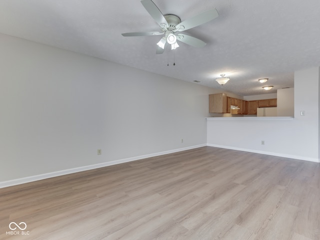 824 Ashton Park Dr, Greenwood, IN 46143 - unfurnished living room featuring light wood finished floors, a ceiling fan, and baseboards