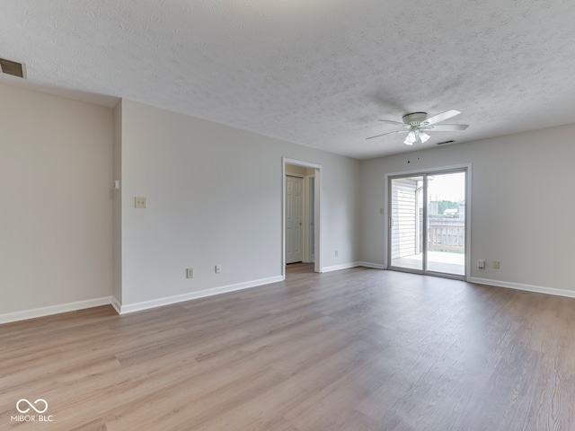 824 Ashton Park Dr, Greenwood, IN 46143 - empty room with ceiling fan, light wood-type flooring, a textured ceiling, and baseboards