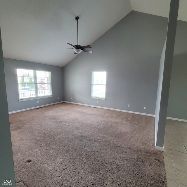 1306 W Daniel Dr, Greensburg, IN 47240 - spare room featuring a ceiling fan, plenty of natural light, baseboards, and high vaulted ceiling
