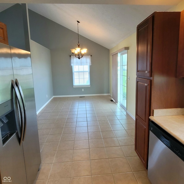 1306 W Daniel Dr, Greensburg, IN 47240 - kitchen featuring appliances with stainless steel finishes, vaulted ceiling, light tile patterned floors, baseboards, and a chandelier