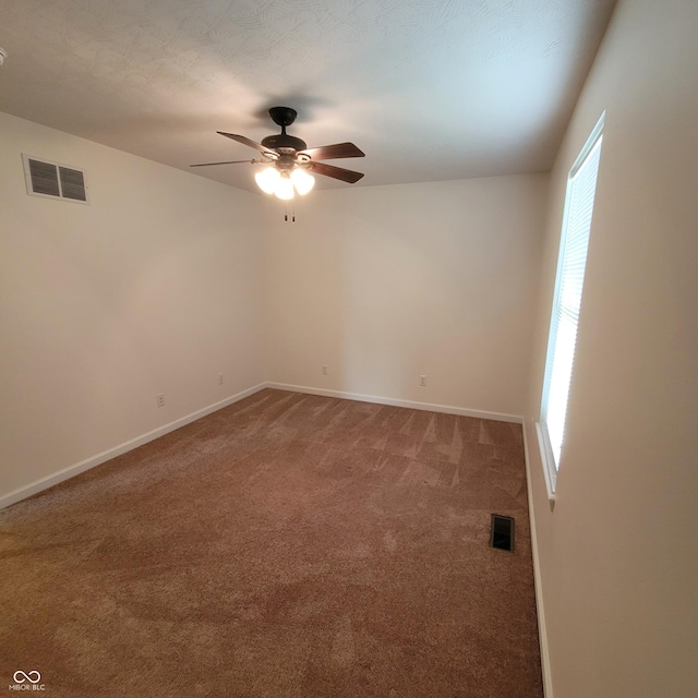 1306 W Daniel Dr, Greensburg, IN 47240 - carpeted empty room with a ceiling fan and baseboards