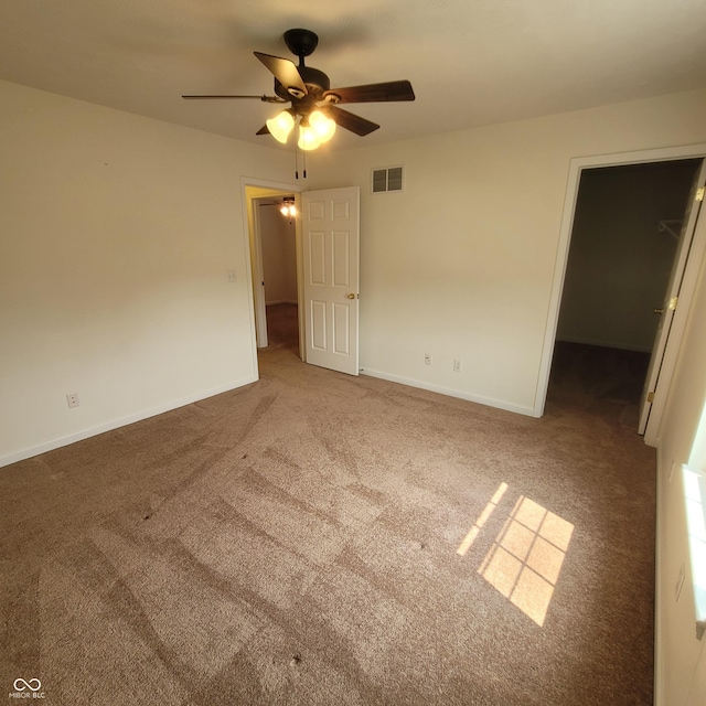 1306 W Daniel Dr, Greensburg, IN 47240 - unfurnished bedroom with carpet floors, a spacious closet, baseboards, and ceiling fan