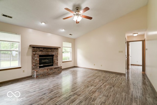 12157 Longstraw Dr, Indianapolis, IN 46236 - unfurnished living room with lofted ceiling, wood finished floors, ceiling fan, baseboards, and a fireplace