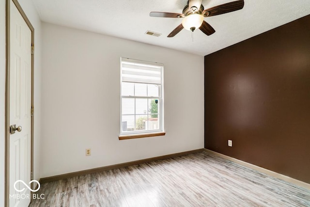12157 Longstraw Dr, Indianapolis, IN 46236 - spare room featuring wood finished floors, baseboards, and a ceiling fan