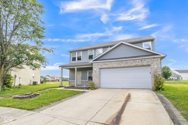 9692 Centennial Ct, Avon, IN 46123 - traditional-style home featuring a fire pit, concrete driveway, a front yard, and a garage