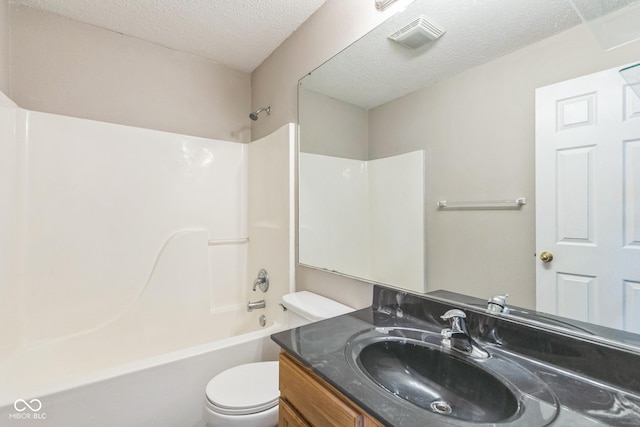9692 Centennial Ct, Avon, IN 46123 - bathroom with toilet, vanity, shower / washtub combination, and a textured ceiling