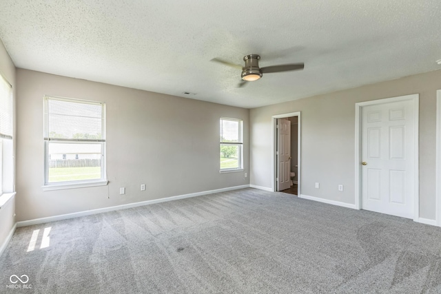 9692 Centennial Ct, Avon, IN 46123 - unfurnished bedroom featuring carpet, baseboards, a textured ceiling, and a ceiling fan
