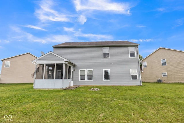 9692 Centennial Ct, Avon, IN 46123 - rear view of house with a sunroom and a lawn