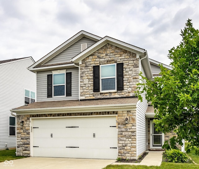 6114 Pebblebrooke Rd, Whitestown, IN 46075 - view of front of home with stone siding, an attached garage, and concrete driveway