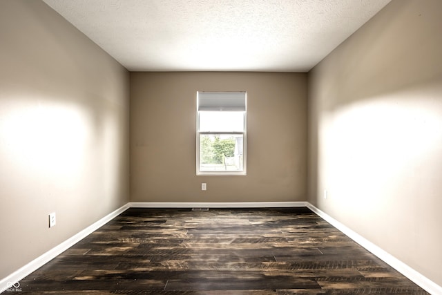 6114 Pebblebrooke Rd, Whitestown, IN 46075 - spare room featuring wood finished floors, baseboards, and a textured ceiling