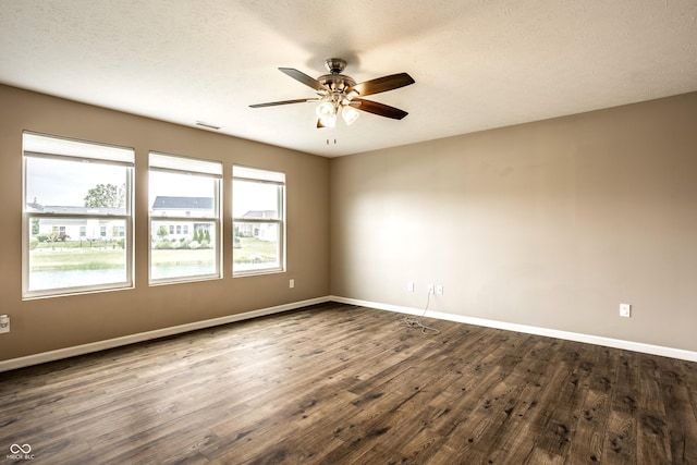 6114 Pebblebrooke Rd, Whitestown, IN 46075 - unfurnished room featuring a ceiling fan, dark wood finished floors, and baseboards