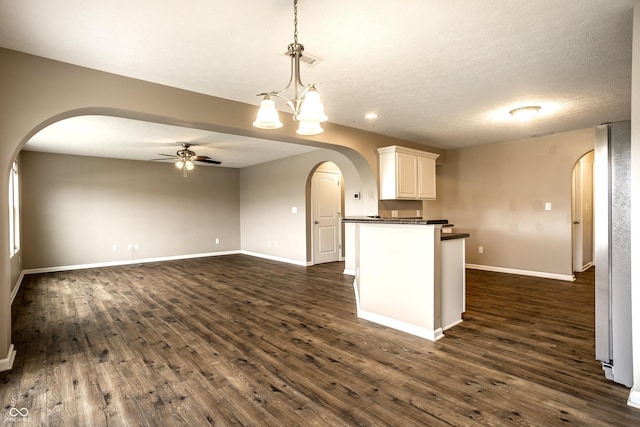 6114 Pebblebrooke Rd, Whitestown, IN 46075 - kitchen featuring arched walkways, dark countertops, ceiling fan, dark wood-style floors, and recessed lighting