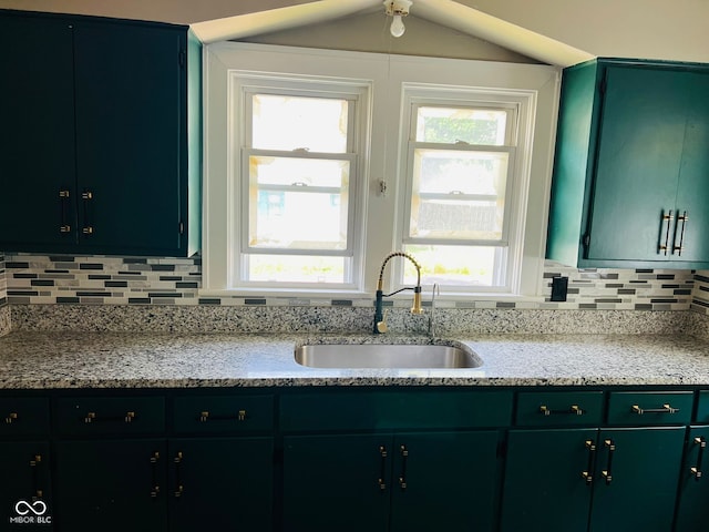 547 N Livingston Ave, Indianapolis, IN 46222 - kitchen featuring a sink, plenty of natural light, tasteful backsplash, and light stone countertops