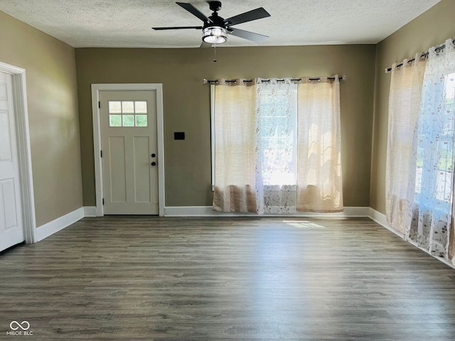 547 N Livingston Ave, Indianapolis, IN 46222 - foyer with a textured ceiling, wood finished floors, ceiling fan, and baseboards