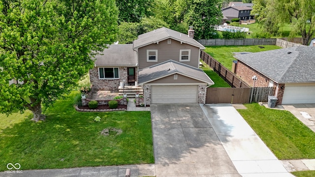 4718 Dancer Dr, Indianapolis, IN 46237 - view of front facade with concrete driveway, a garage, a gate, brick siding, and a shingled roof