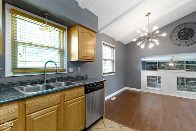 4718 Dancer Dr, Indianapolis, IN 46237 - kitchen with dishwasher, dark countertops, a chandelier, hanging light fixtures, and light tile patterned floors