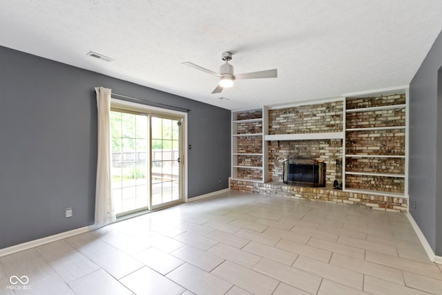 4718 Dancer Dr, Indianapolis, IN 46237 - unfurnished living room with ceiling fan, a brick fireplace, a textured ceiling, and built in shelves