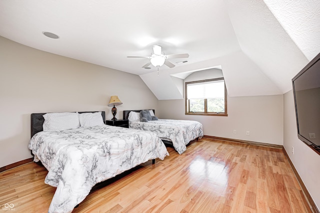 4181 Whitetail Woods Dr, Bargersville, IN 46106 - bedroom featuring light wood-style floors, a ceiling fan, lofted ceiling, and baseboards